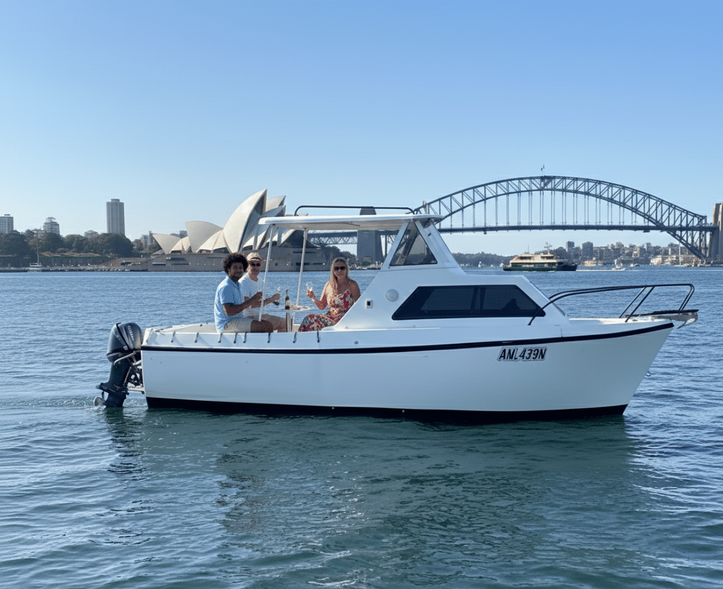 The Coral day boat on Sydney Harbour with the Opera House and Harbour Bridge behind, no licence required
